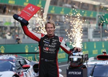 Brendon Hartley holding pole position trophy