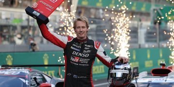 Brendon Hartley holding pole position trophy