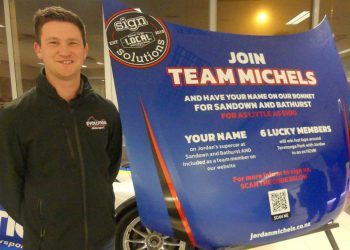 Jordan Michel in front of bonnet