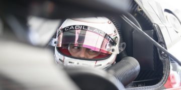 Earl Bamber testing Cadillac Racing LMDh car with helmet on