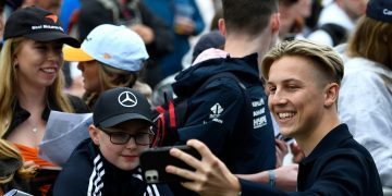 Liam Lawson taking picture with fan at British GP