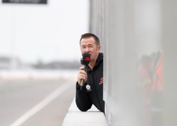 Greg Murphy commentating from pit lane at track