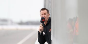 Greg Murphy commentating from pit lane at track