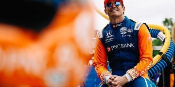Scott Dixon sitting down with hands together