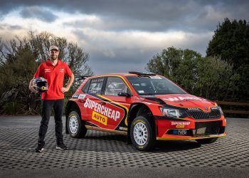 Shane van Gisbergen standing next to Skoda Fabia R5