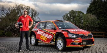 Shane van Gisbergen standing next to Skoda Fabia R5