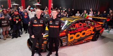 Greg Murphy and Richie Stanaway standing next to Erebus Motorsport Boost Mobile Holden Commodore Supercar