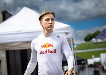 Liam Lawson walking through race paddock