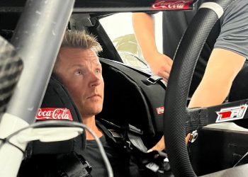 Kimi Raikonnen sitting in NASCAR