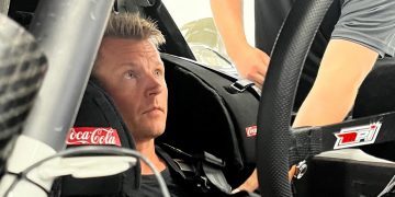 Kimi Raikonnen sitting in NASCAR