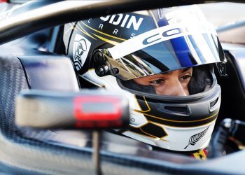 Louis Sharp sitting in Formula 4 car with helmet on