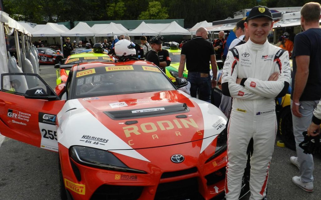 Harry McDonald standing next to Toyota Gazoo Racing GR Supra GT4