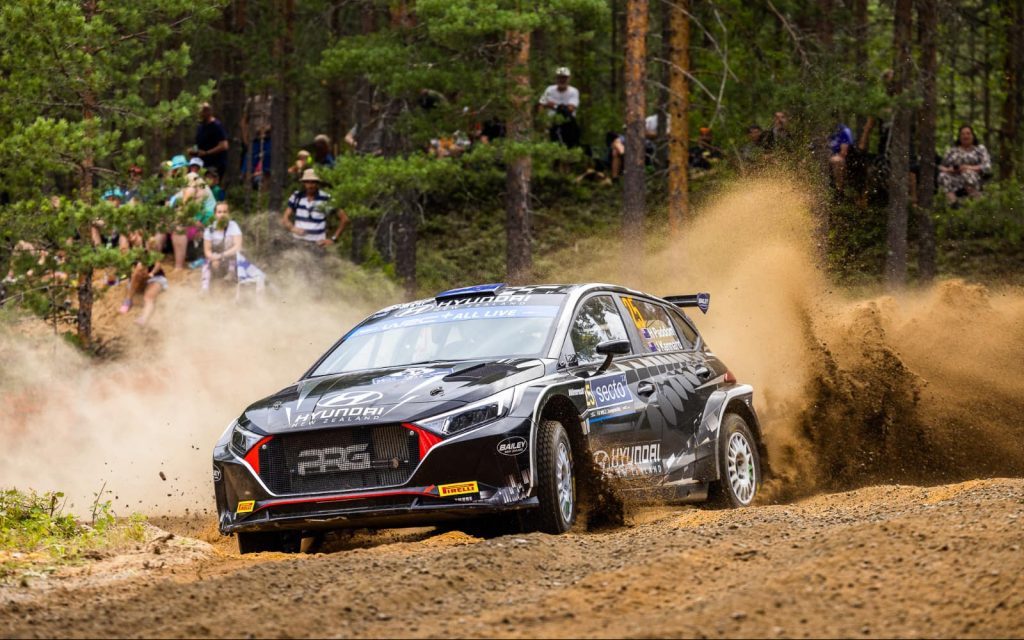 Hayden Paddon's Hyundai i20 N Rally2 WRC2 car drifting around dirt corner
