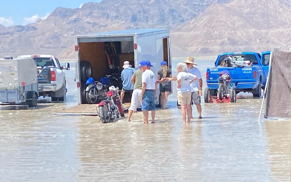 Bonneville Salt Flats flooded trailer with people standing