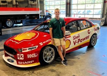 Scott McLaughling standing next to championship winning Ford Falcon FG X Supercar