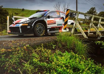 Toyota GR Yaris rally car racing over bridge