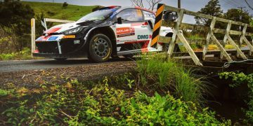 Toyota GR Yaris rally car racing over bridge