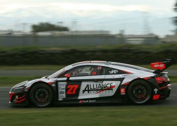 Audi R8 LMS Evo side view racing on track