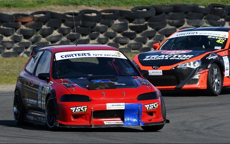 Honda Civic EG racing on track with Toyota TR86 behind