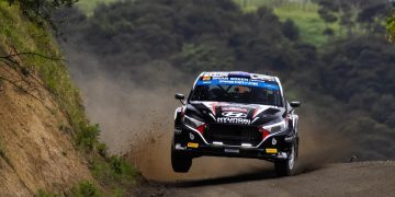 Hyundai i20 Rally2 on two wheels while racing on gravel road