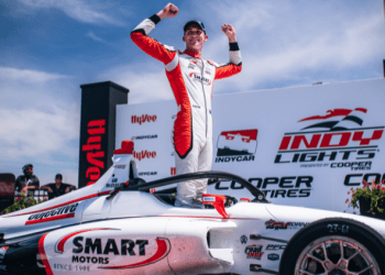 Hunter McElrea celebrating on top of Andretti Autosport Indy Lights car