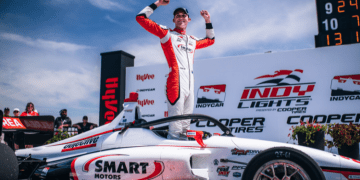 Hunter McElrea celebrating on top of Andretti Autosport Indy Lights car