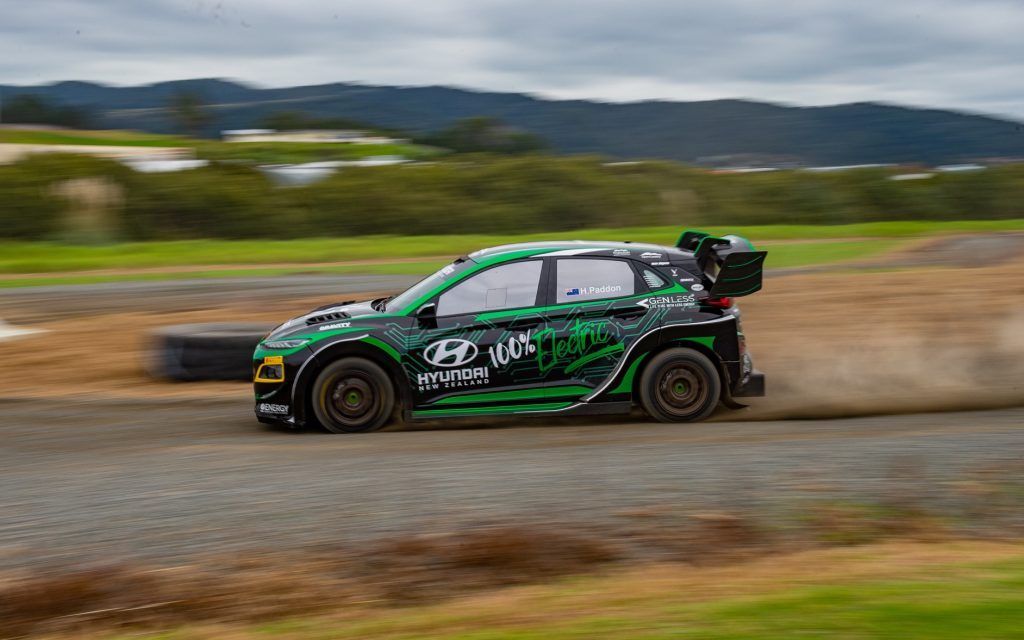 Hayden Paddon's Hyundai Kona EV on gravel track side view