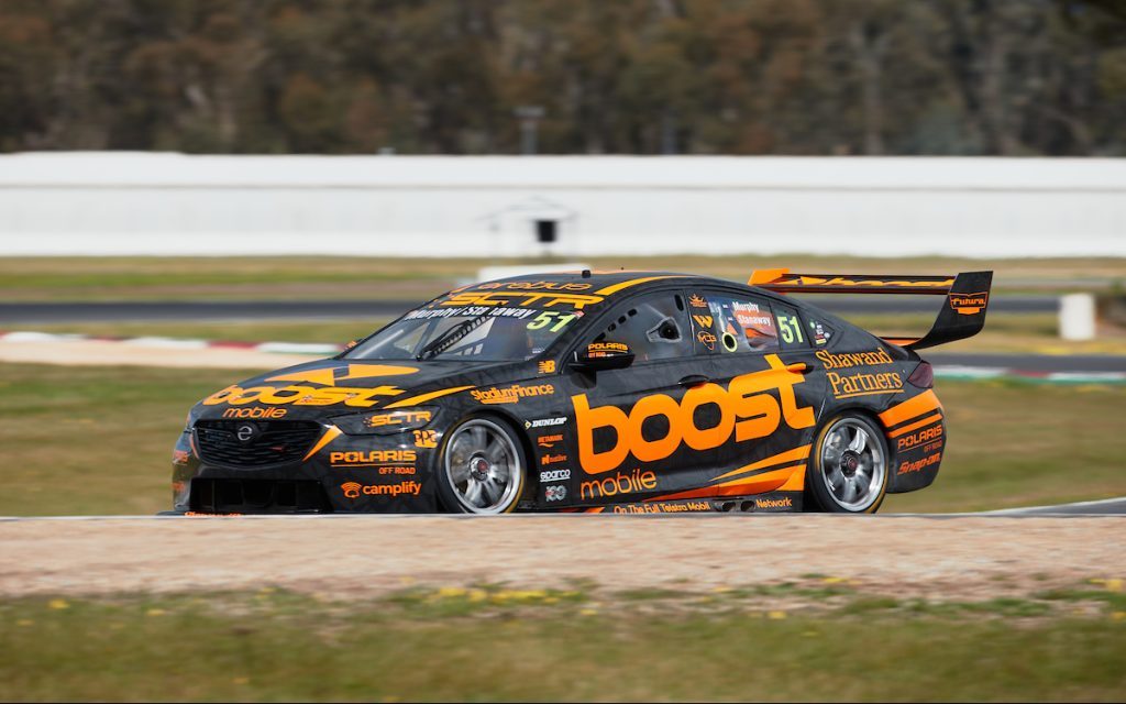 Boost Mobile Holden ZB Commodore front three quarter view racing on track
