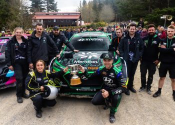 Hayden Paddon holding up winning Ashley Forest Rallysprint trophy with team
