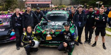 Hayden Paddon holding up winning Ashley Forest Rallysprint trophy with team