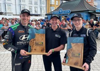 Hayden Paddon and Jared Hudson holding first place trophies at Rali Ceredigion