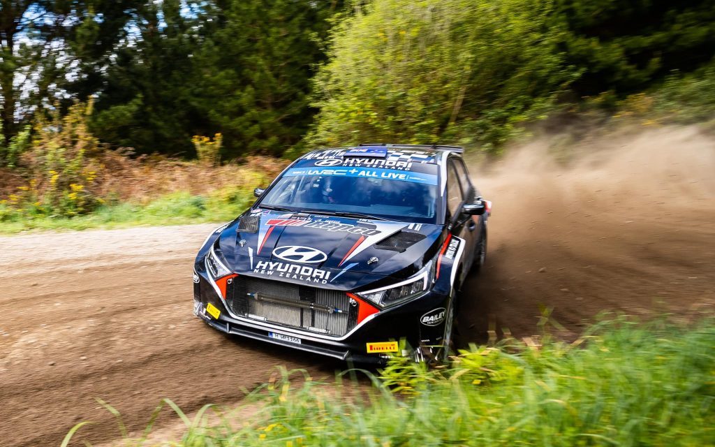 Hayden Paddon's Hyundai i20 N Rally2 WRC2 car drifting on dirt road