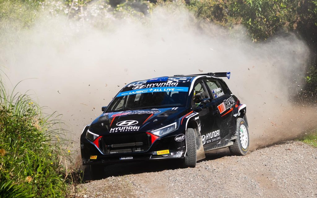 Hayden Paddon's Hyundai i20 Rally2 car drifting on dirt road