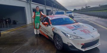 Thomas Randle standing next to Toyota 86 race car at Pukekohe