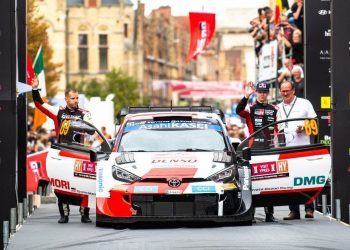Rovanpera and Halttunen celebrating with Toyota Yaris WRC car in Belgium