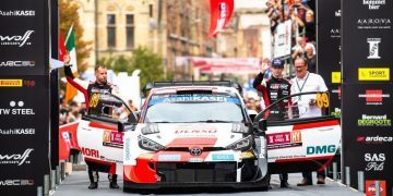 Rovanpera and Halttunen celebrating with Toyota Yaris WRC car in Belgium