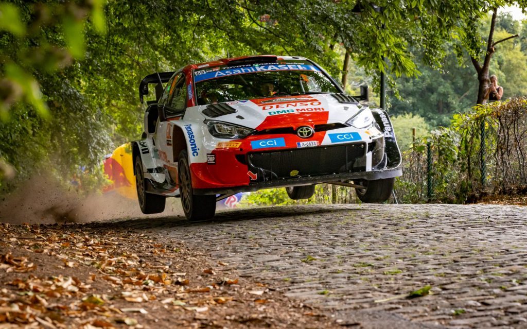 Toyota Gazoo Racing WRC Yaris jumping on cobble road