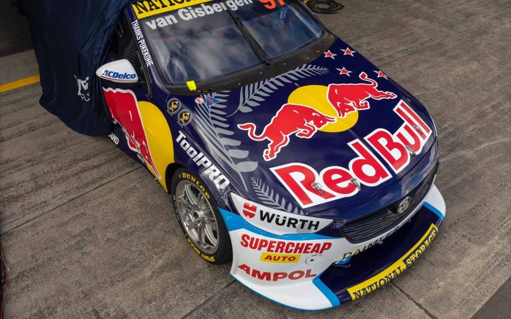 Shane van Gisbergen's Holden ZB Commodore Supercar front three quarter view high angle