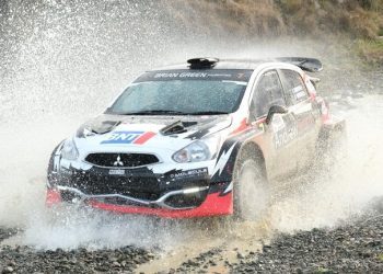 Mitsubishi Mirage water splash during rally race