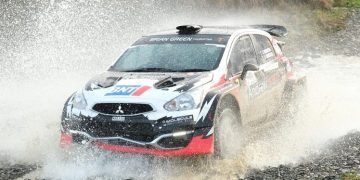 Mitsubishi Mirage water splash during rally race