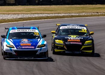 Two Mazda RX8s racing on track