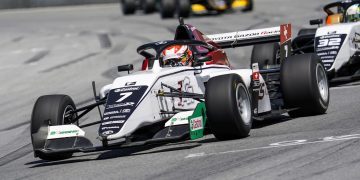 Toyota Race Series car front three quarter view on track