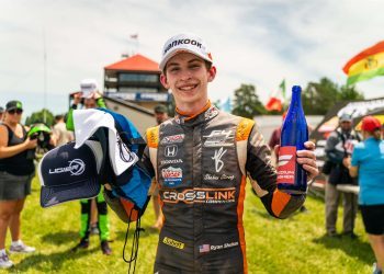 Ryan Shehan holding podium bottle