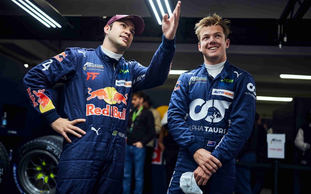 Felipe Fraga and Nick Cassidy in pit garage