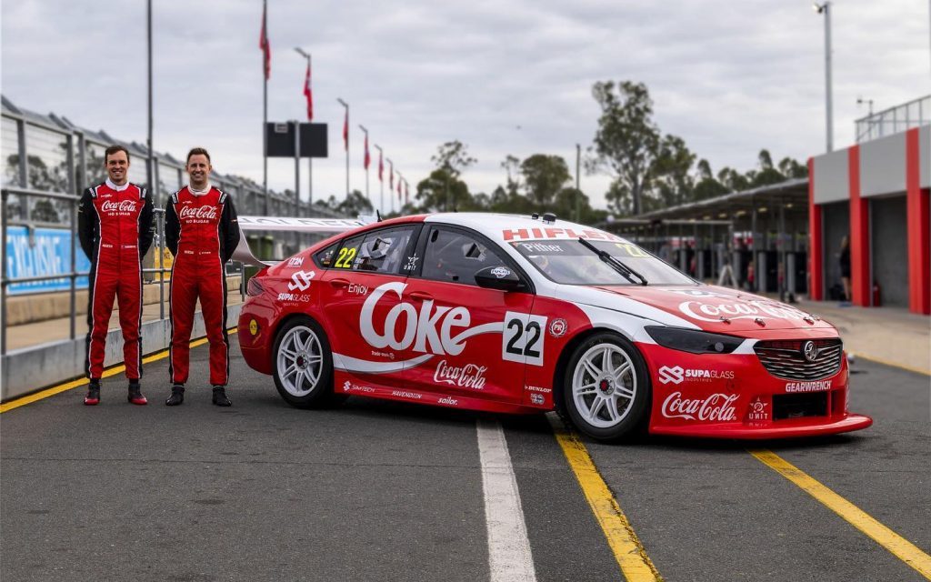 Christ Pither standing with Holden ZB Commodore Supercar in Bathurst 1000 livery
