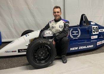 James Penrose sitting with Formula Ford car