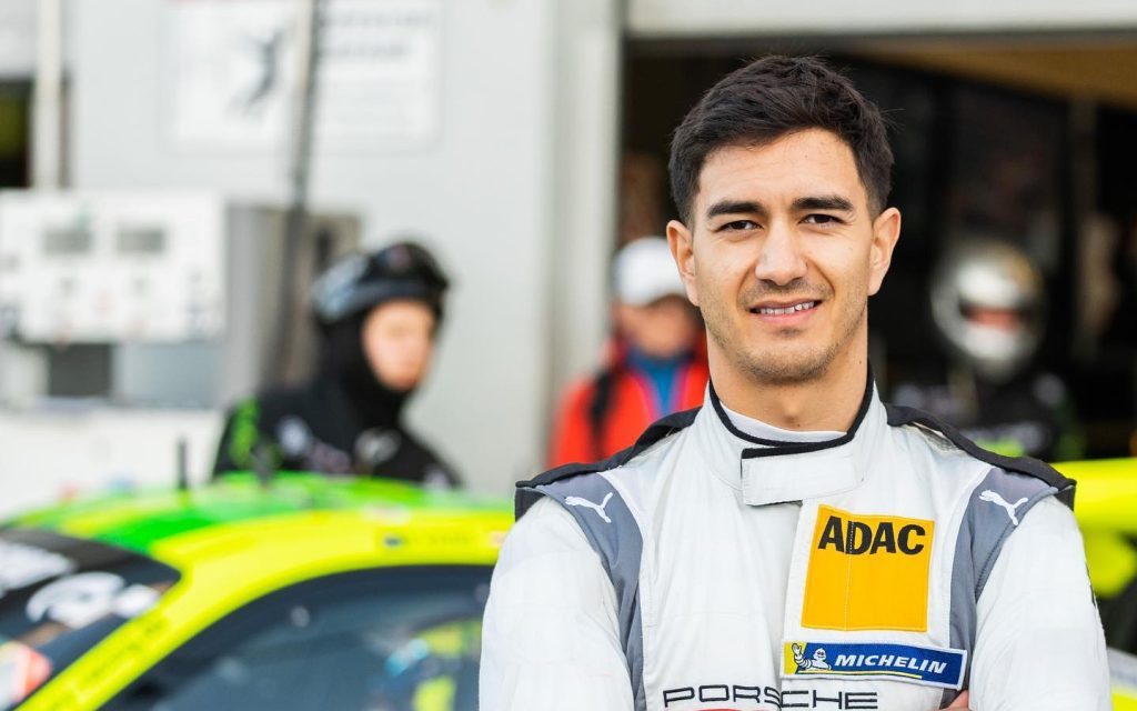 Jaxon Evans standing in front of Porsche 911 GT3 R