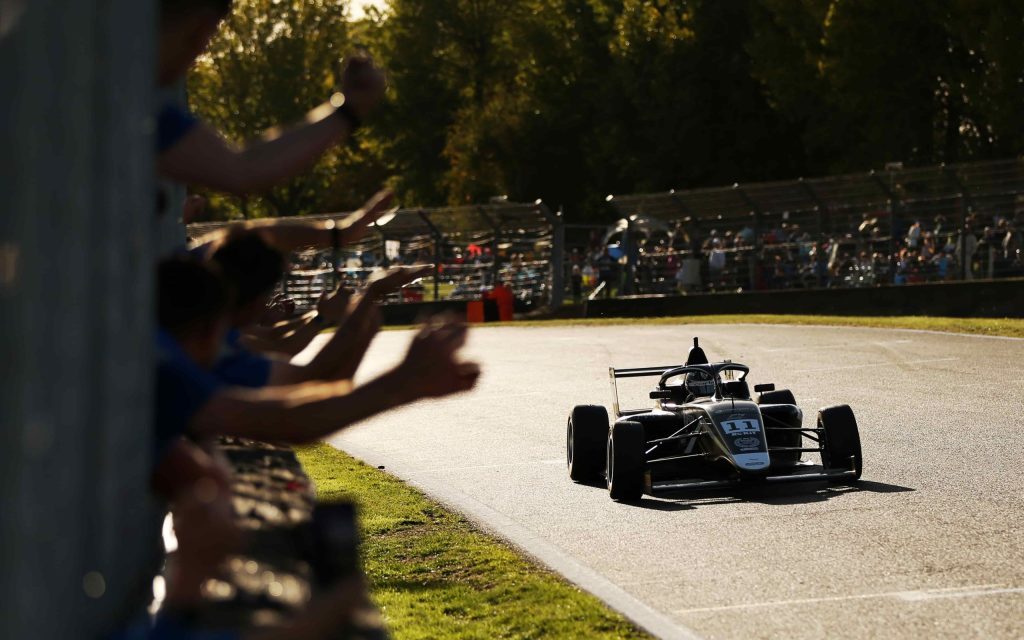 Louis Sharp Formula 4 car racing on track front view