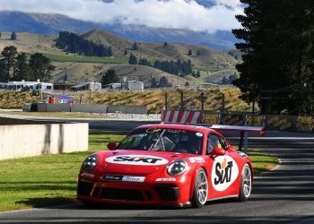 Porsche 911 race car front three quarter view at Highlands race track