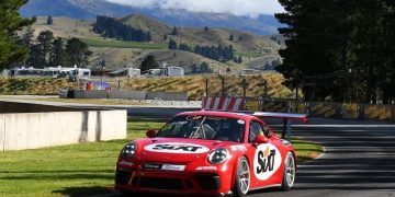 Porsche 911 race car front three quarter view at Highlands race track